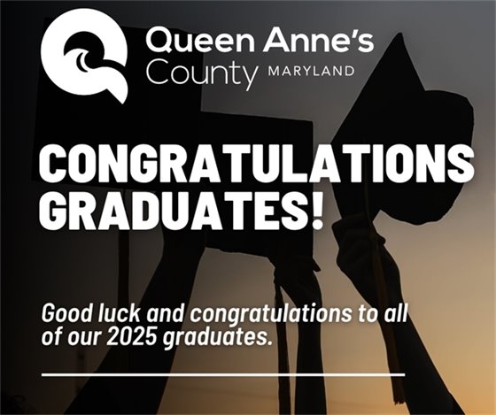 hands holding graduation caps in air