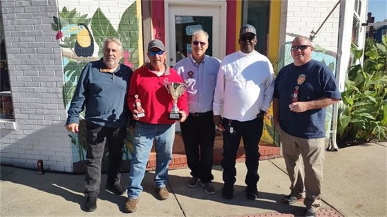 several men standing in a row in front of a store
