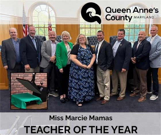 a row of men with two women in the middle all in professional clothing