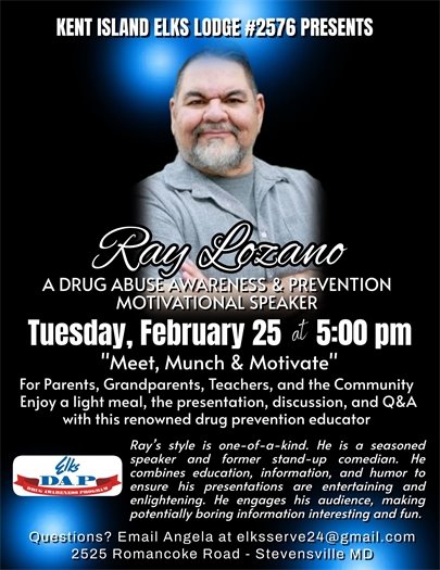 man with dark hair and white beard and black background